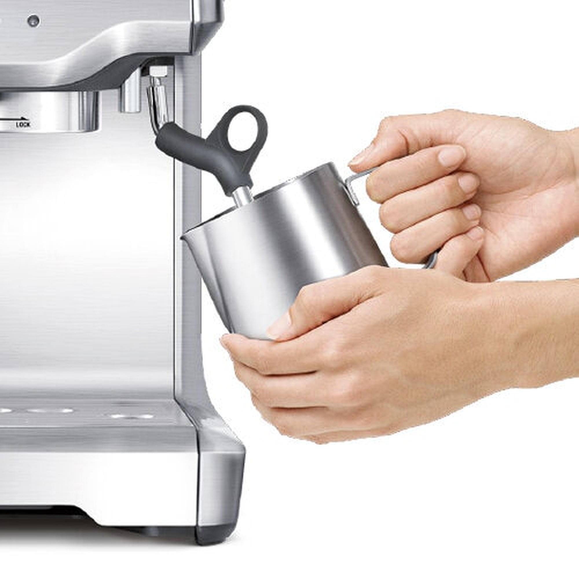 Milk being textured with the steam wand